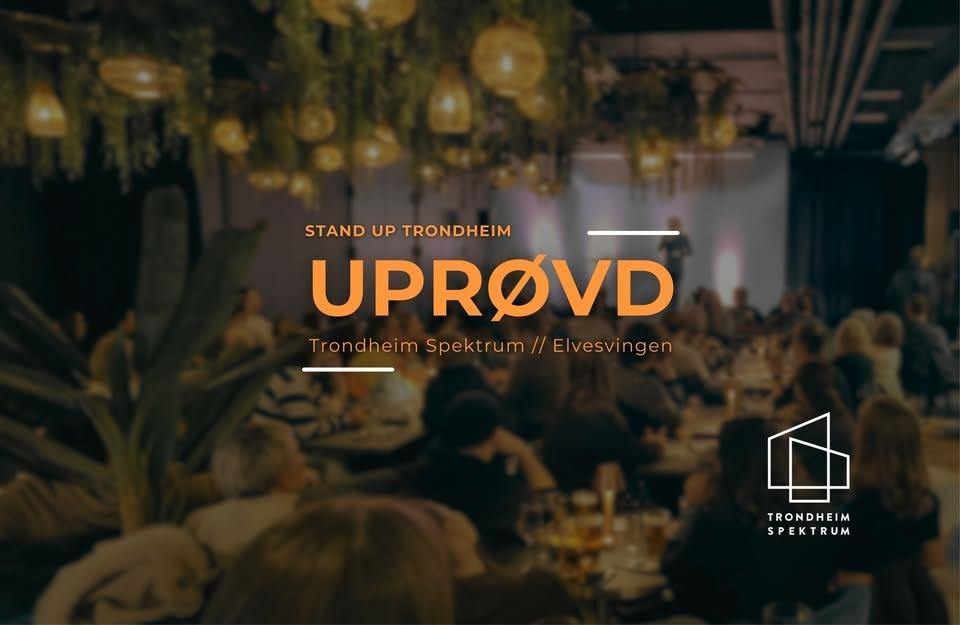 May be an image of drink and text that says "STAND STANDUPTRONDHEIM UP TRONDHEIM UPROVD Trondheim Spektrum TrondheimSpektruom//Elvesvingen // Elvesvingen um TRONDHEIM SPEKTRUM"