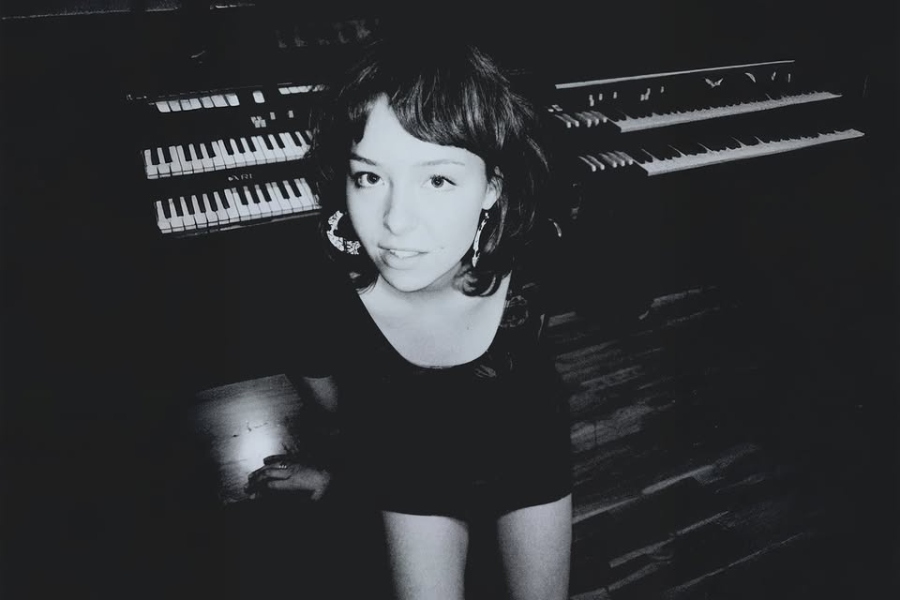 May be a black-and-white image of 1 person, child and piano