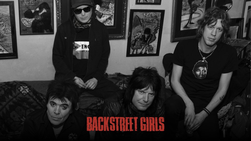 May be a black-and-white image of text that says 'L 44 T-ECOMS EN M BACKSTREET GIRLS'