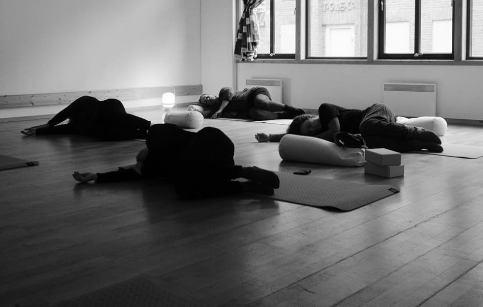 May be an image people resting on the floor