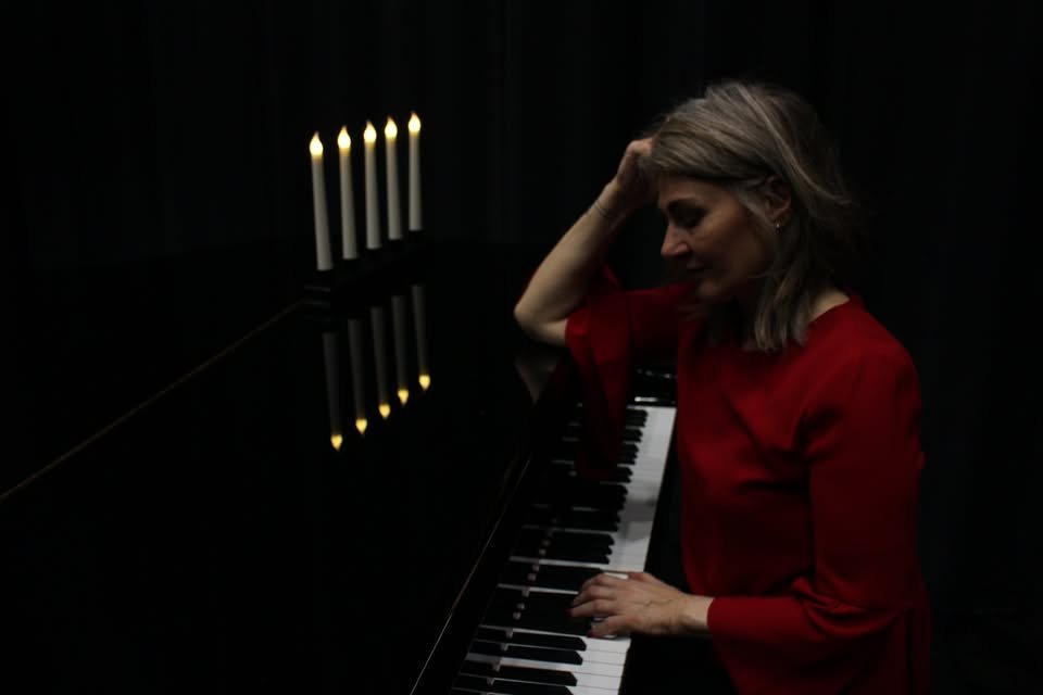 May be an image of candle holder and piano