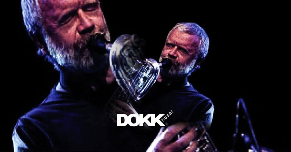 May be an image of saxophone and text