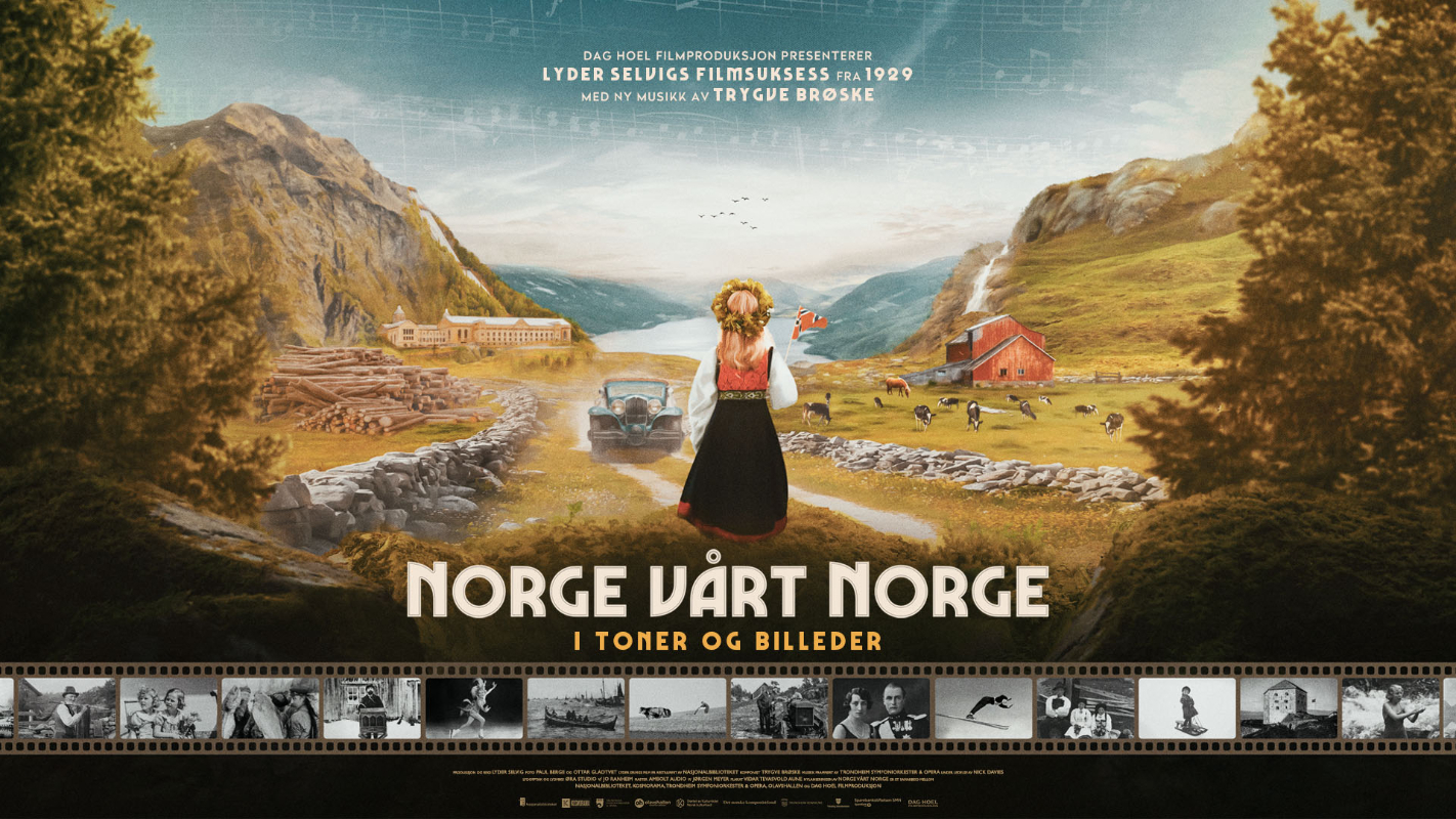 Jente i bunad med norsk flagg i hånden ser utover norske fjell og fjorder