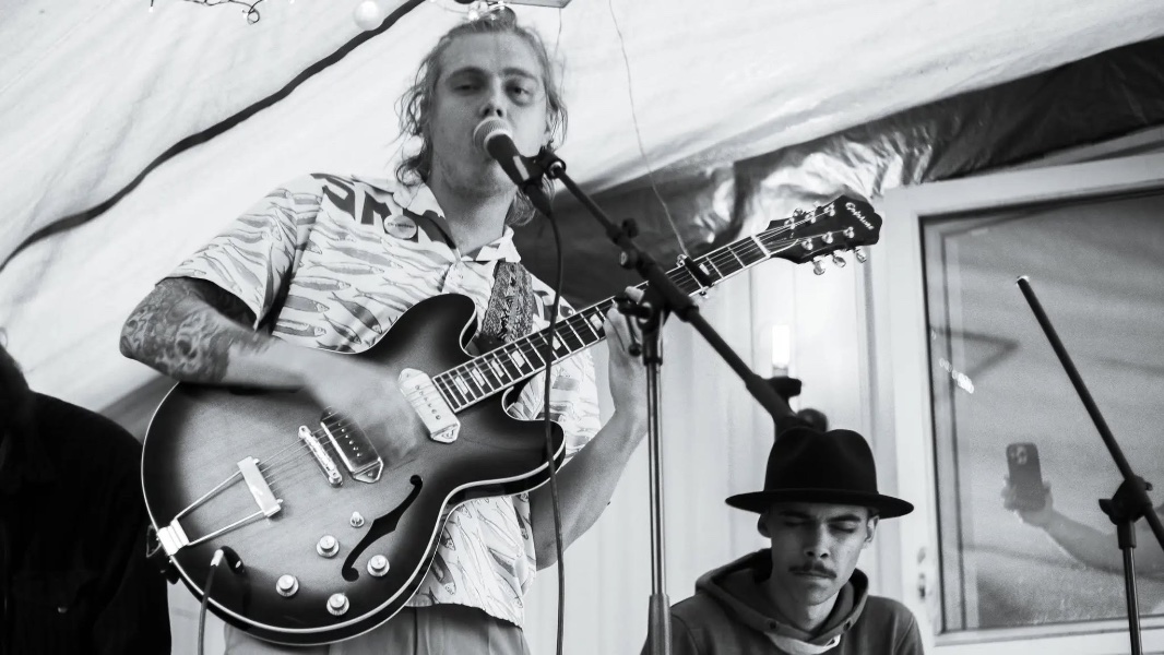 May be a black-and-white image of guitar and text
