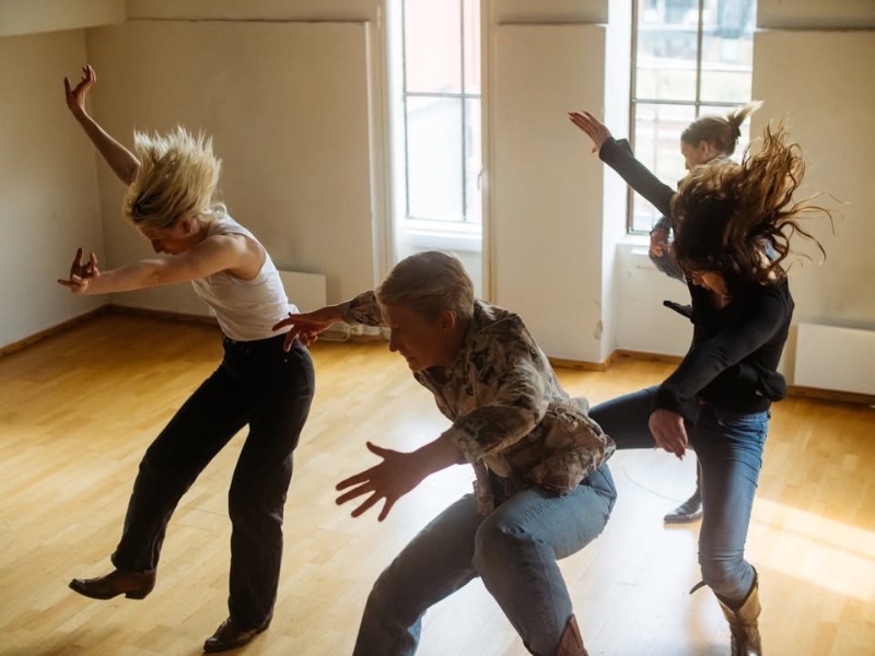 May be an image of three people dancing