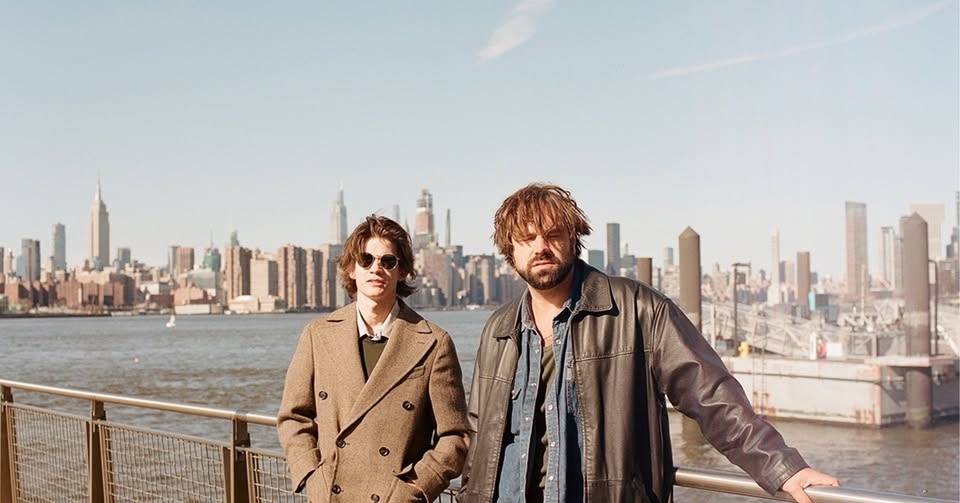 May be an image of 2 people and the Queensboro Bridge