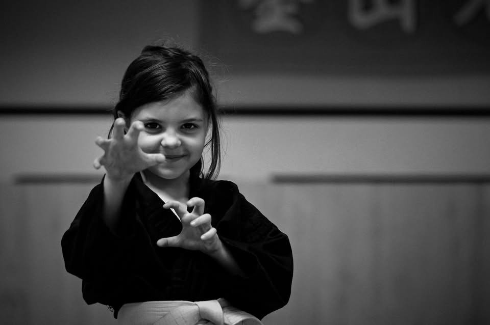 May be a black-and-white image of child and martial arts
