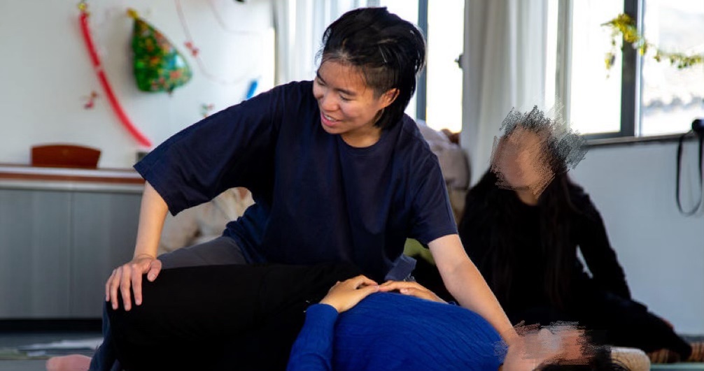 May be an image of a person practicing Thai Massage