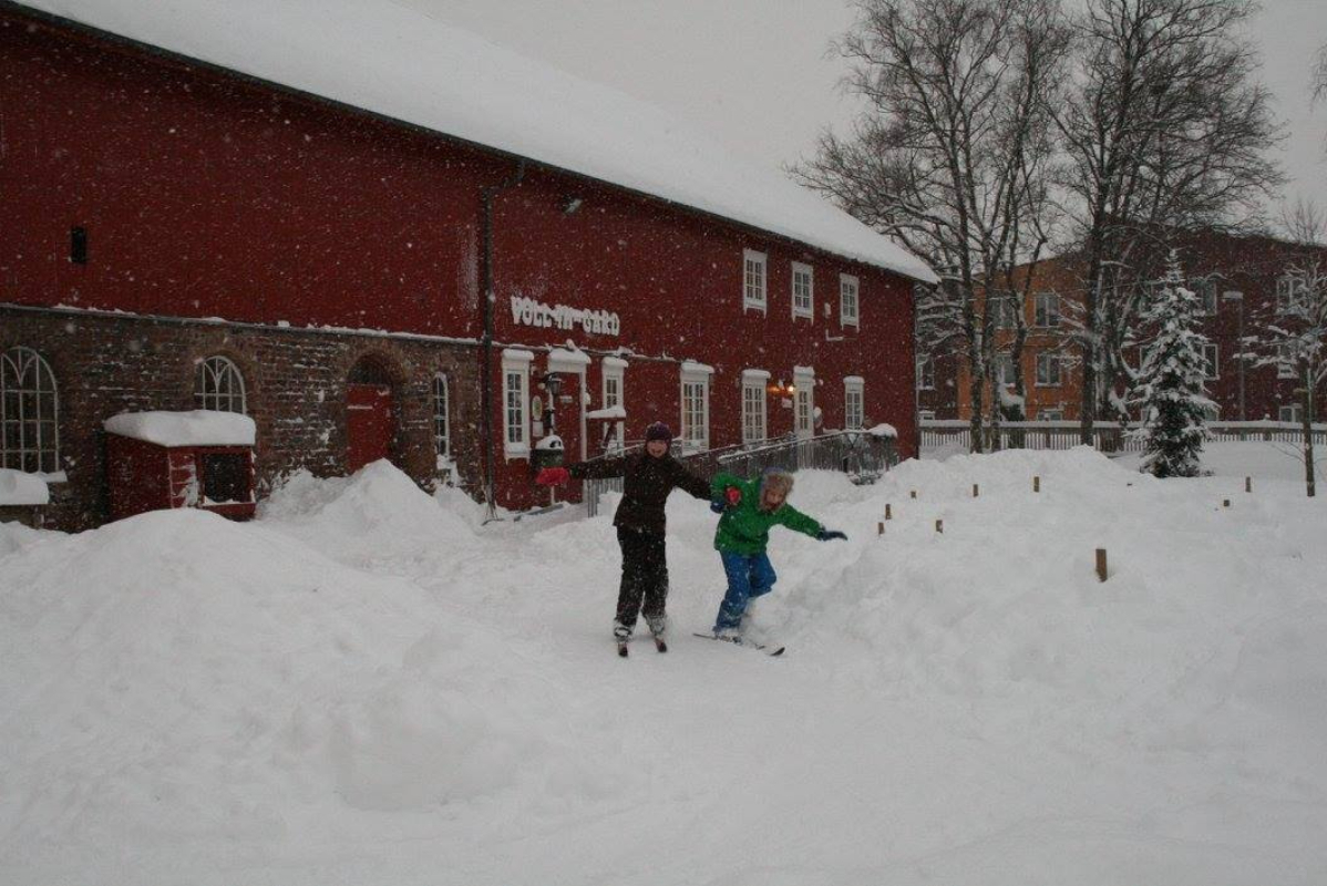 May be an image of 2 people, snowball, people skiing and arctic