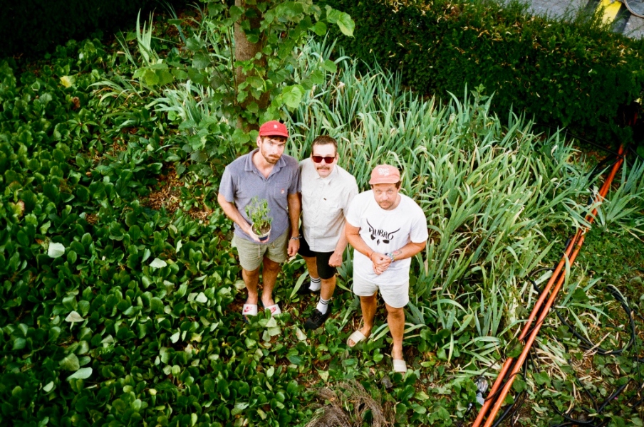 May be an image of 3 people and grass