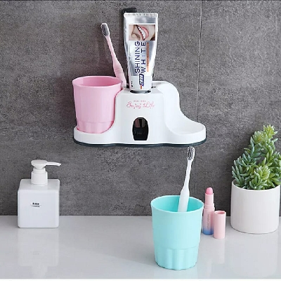 Toothbrush holder with toothpaste dispenser