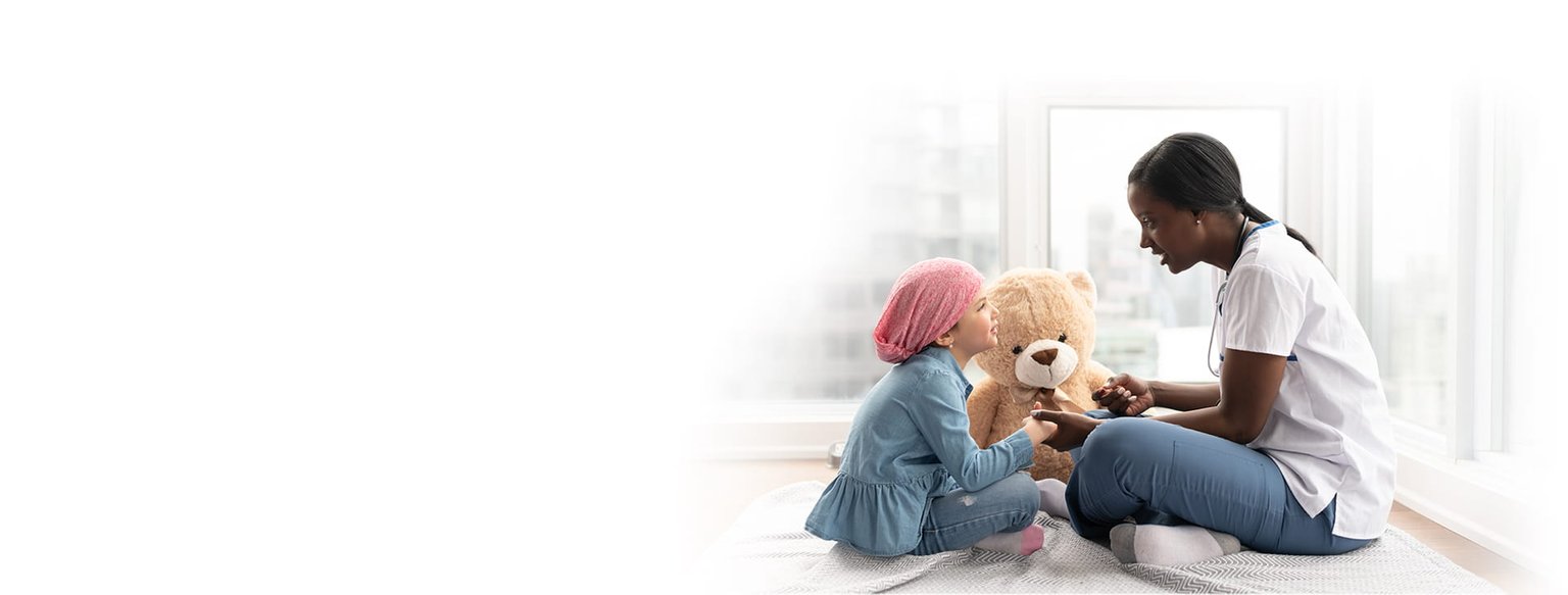Nurse, child, and a stuffed bear.