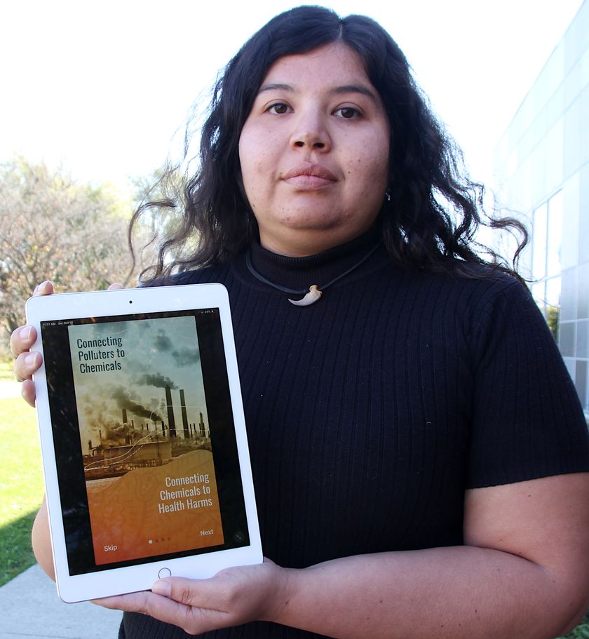 Vanessa Gray holding Pollution Reporter App at launch, from Sarnia Observer