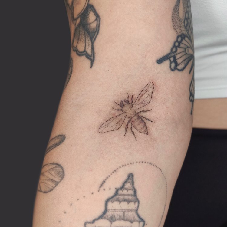 Tatuaje de Regina Tattoo