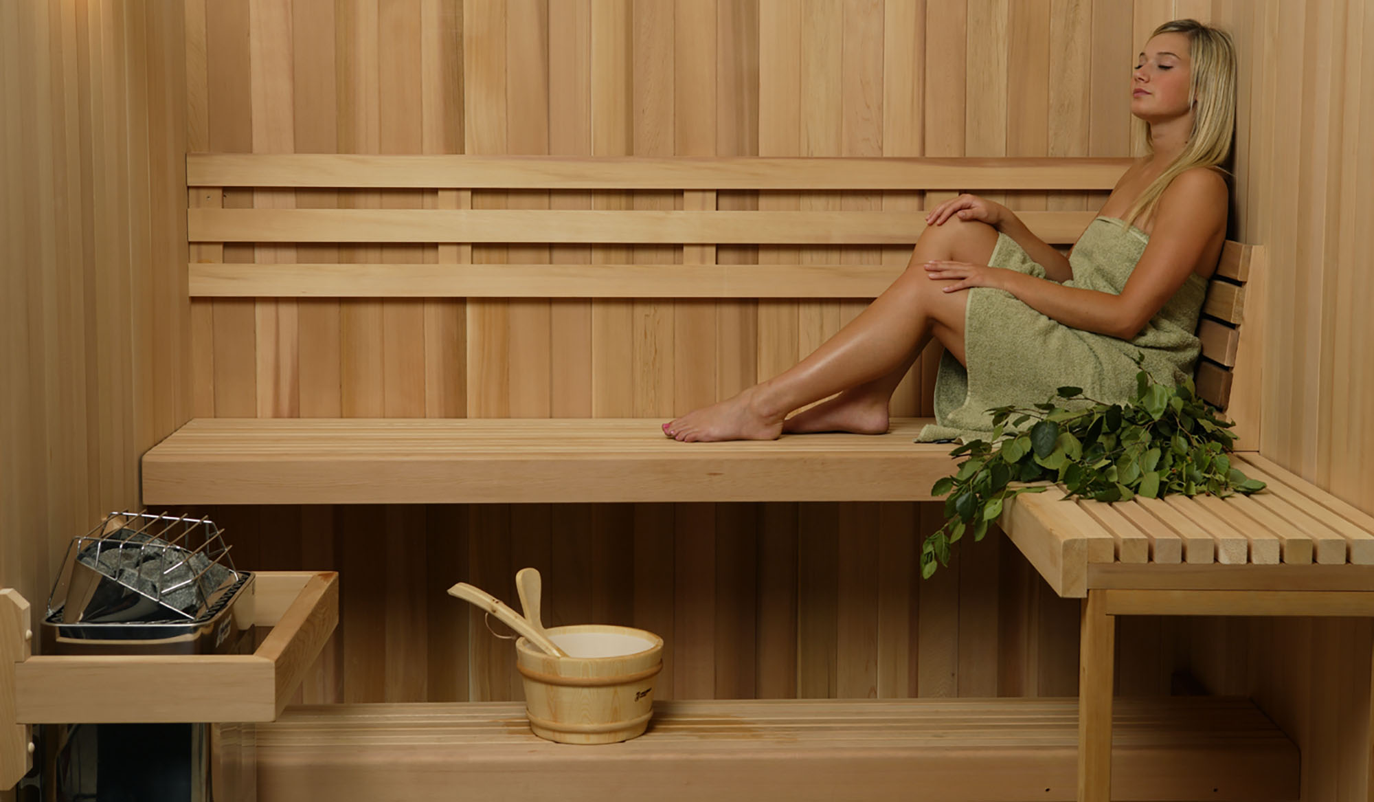 Woman relaxing in a premium sauna