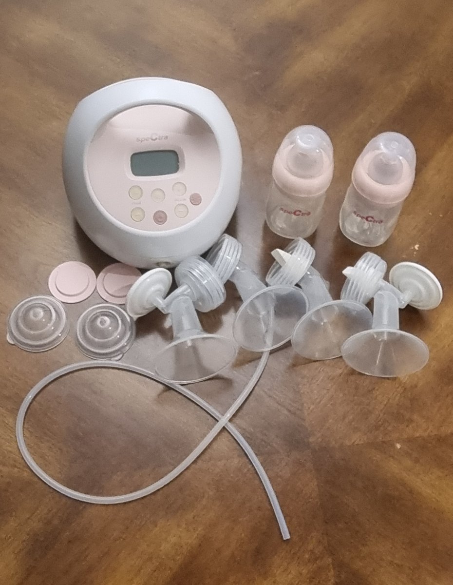 Spectra Medical Grade Breast Pump. Single or double ppl capability, vacuum suction with 2 spectra bottles.  Was never used 2