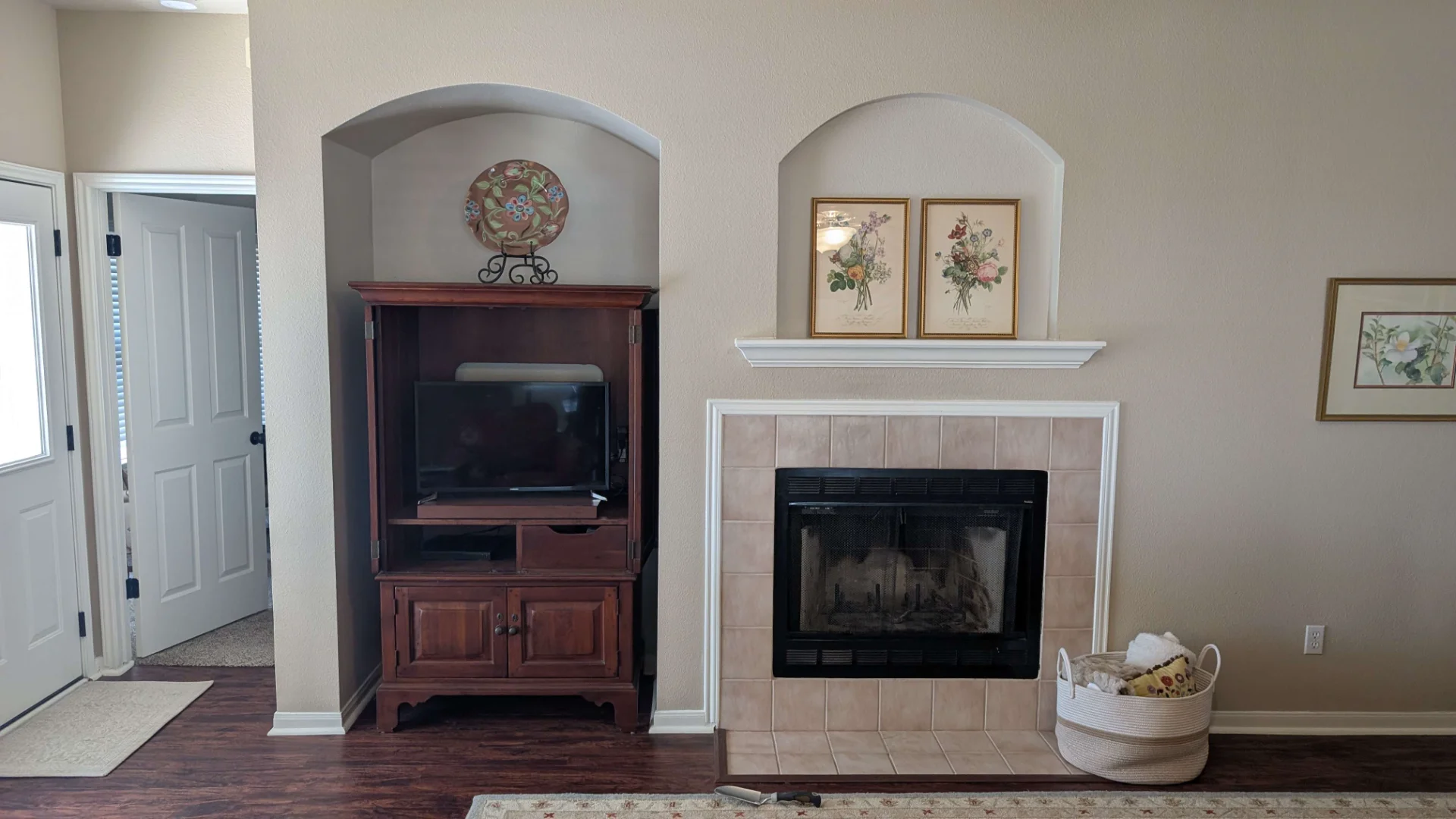 Patterned tile fireplace with wood mantle and built-in shelving in an Austin home. - Detail 2