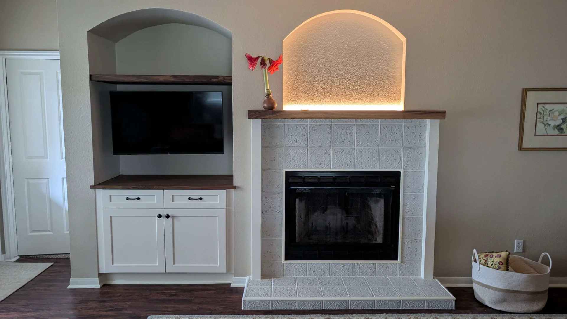 Patterned tile fireplace with wood mantle and built-in shelving in an Austin home. - Detail 3