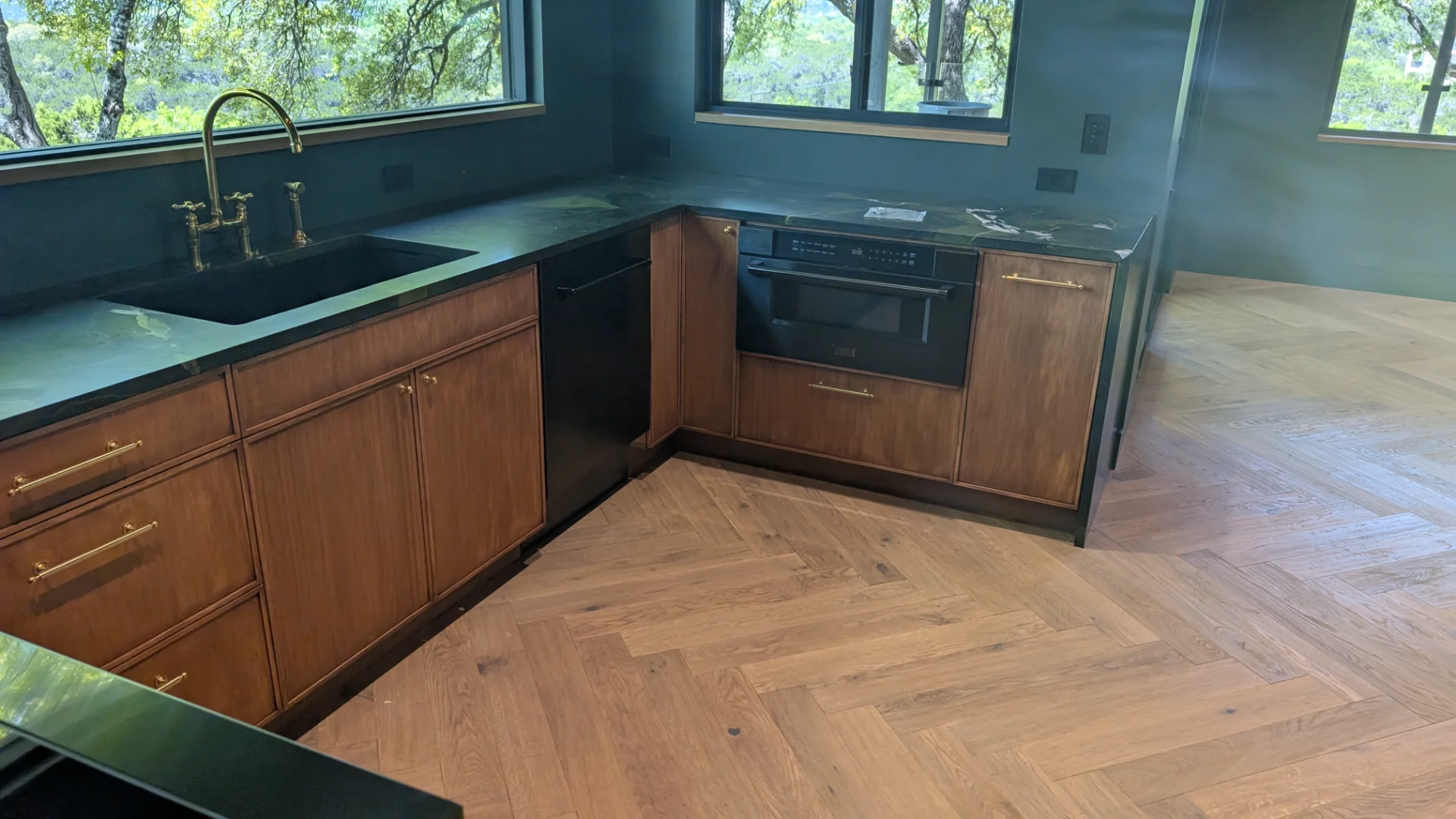 Custom fluted wood cabinetry with brass hardware in a luxury West Lake Hills Austin residence. - Detail 10