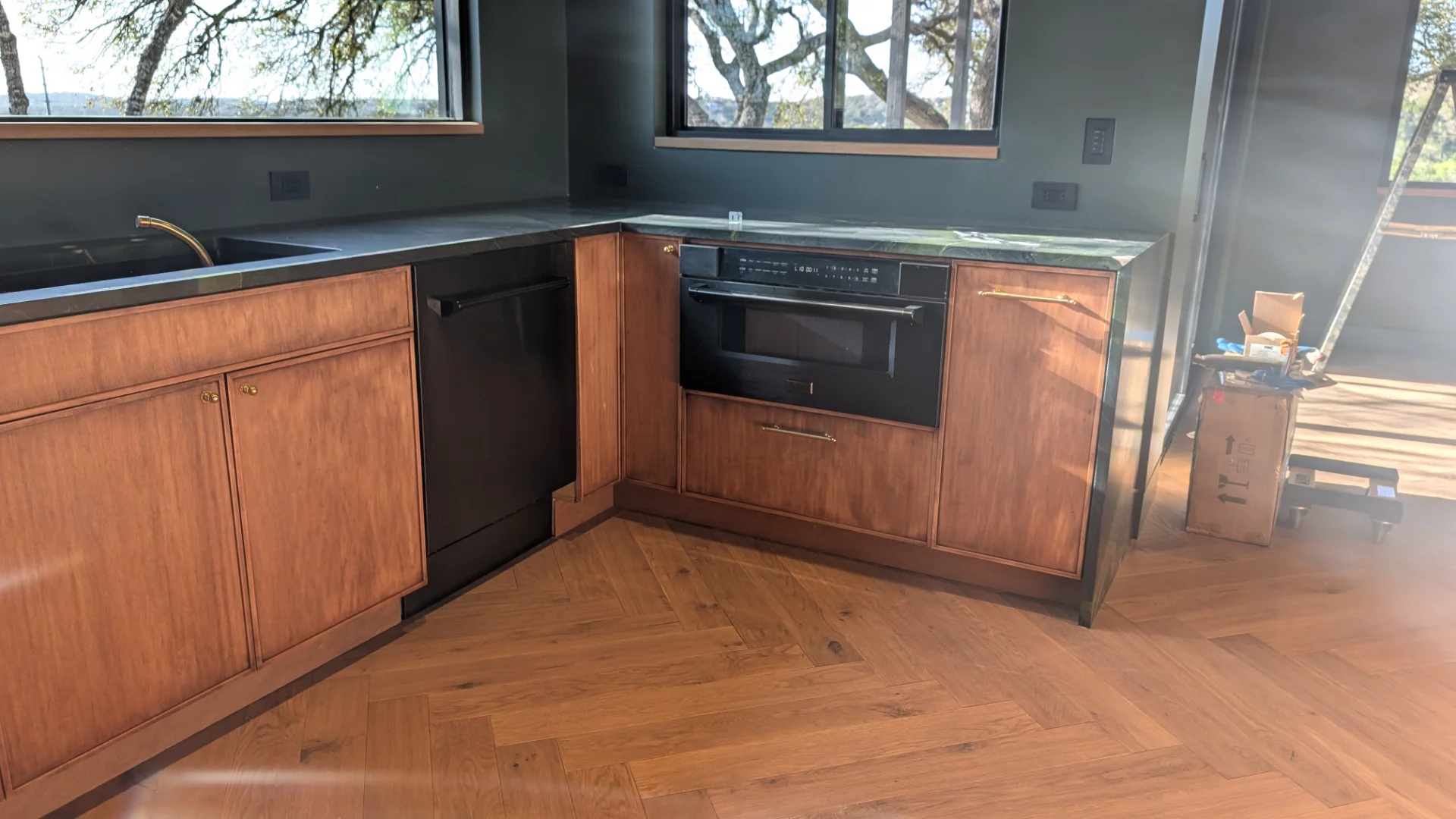 Custom fluted wood cabinetry with brass hardware in a luxury West Lake Hills Austin residence. - Detail 5