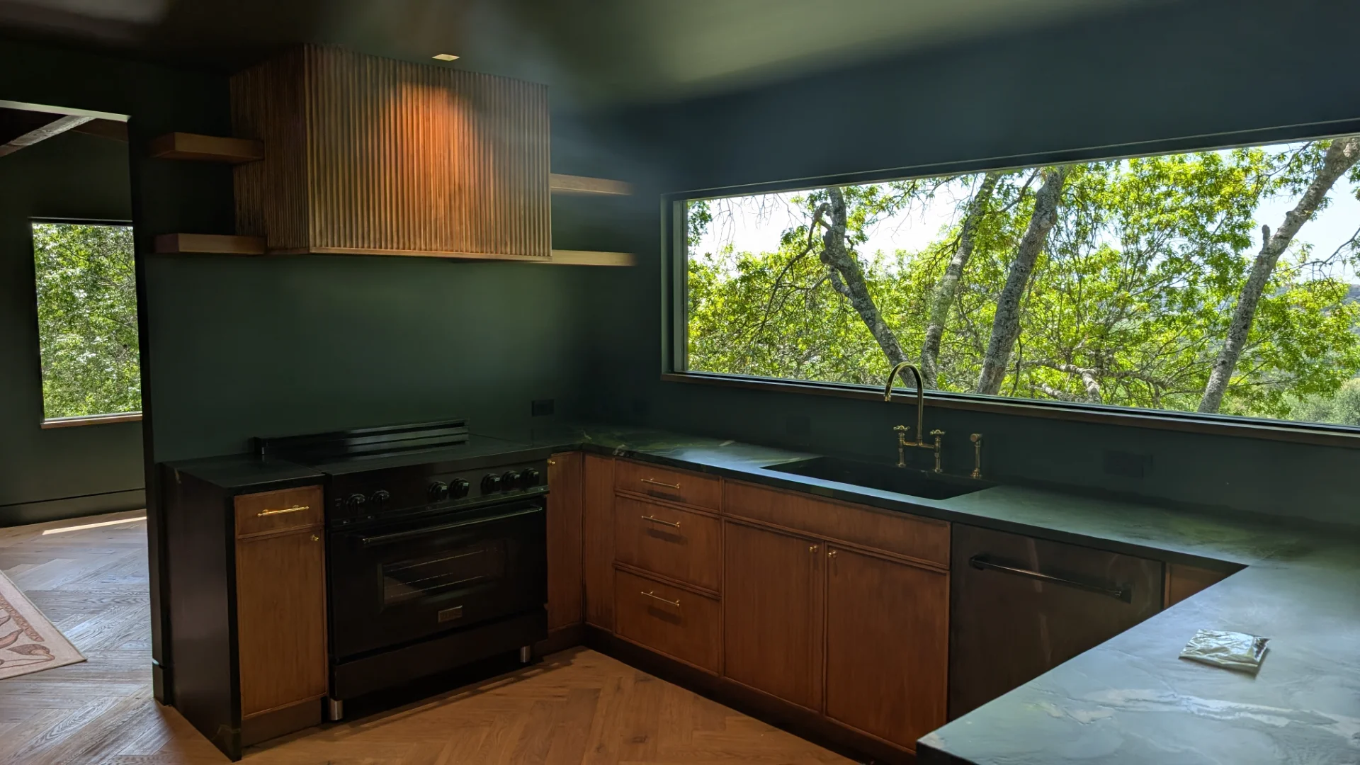 Custom fluted wood cabinetry with brass hardware in a luxury West Lake Hills Austin residence. - Detail 9