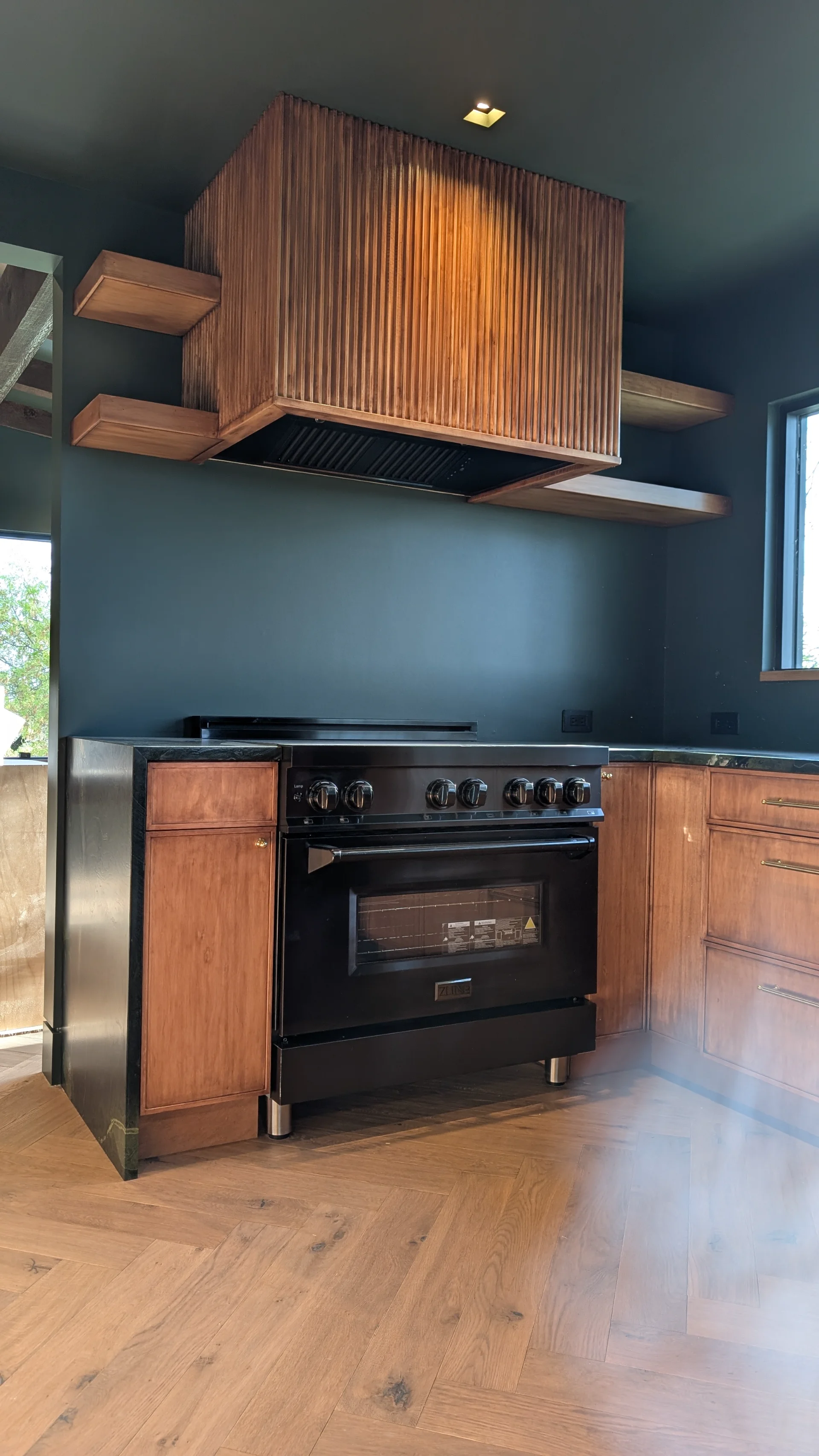 Custom fluted wood cabinetry with brass hardware in a luxury West Lake Hills Austin residence. - Detail 2