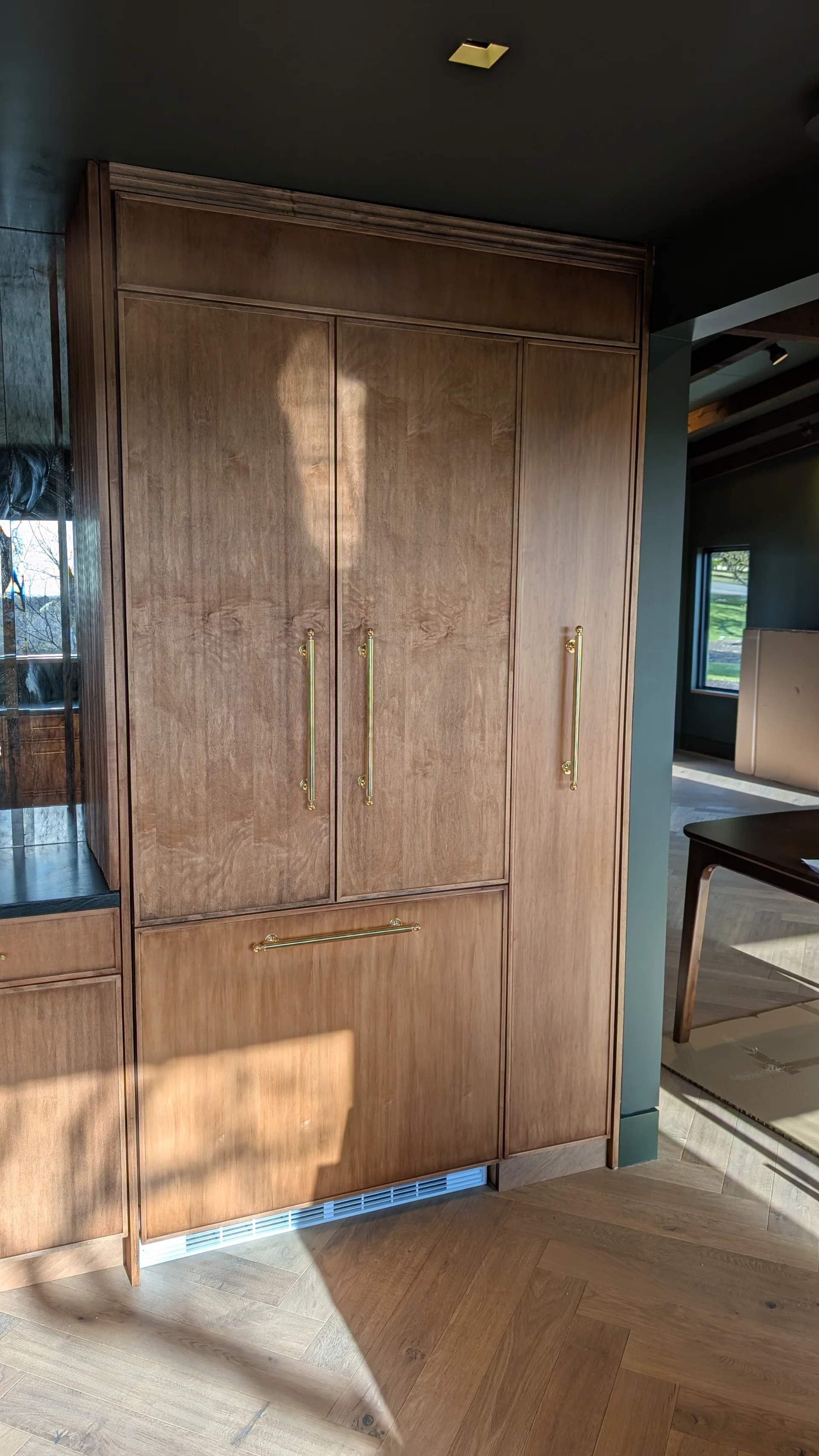 Custom fluted wood cabinetry with brass hardware in a luxury West Lake Hills Austin residence. - Detail 7