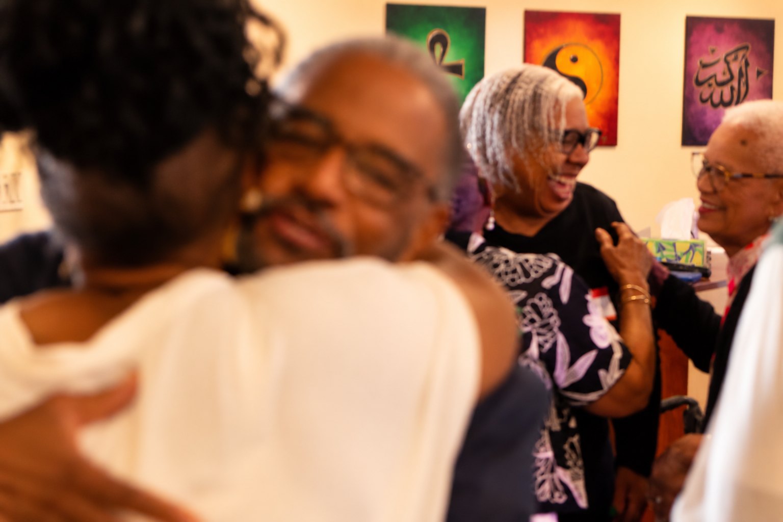 Members embracing during fellowship