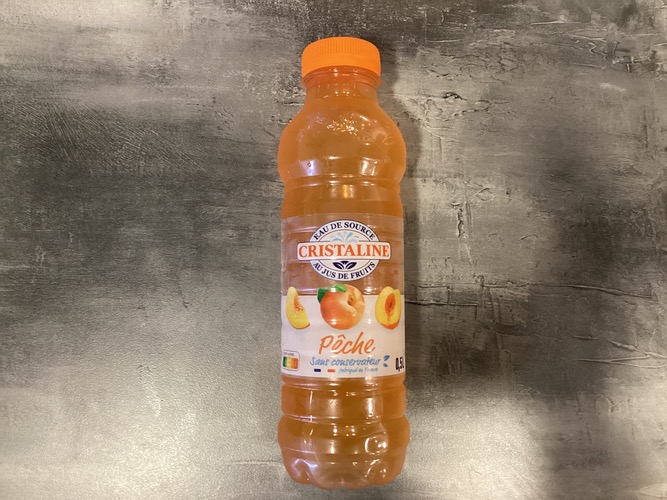 Photo du produit Eau cristaline Pêche 50 cl, non contractuelle