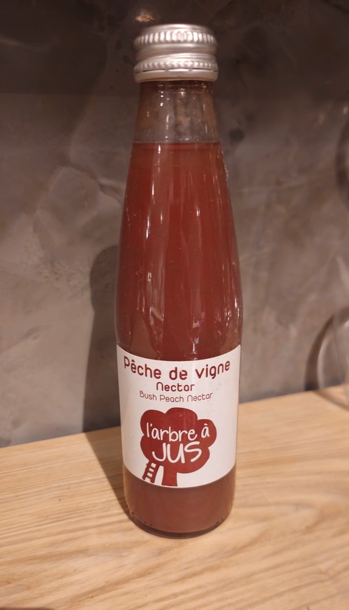 Photo du produit jus de peche, non contractuelle