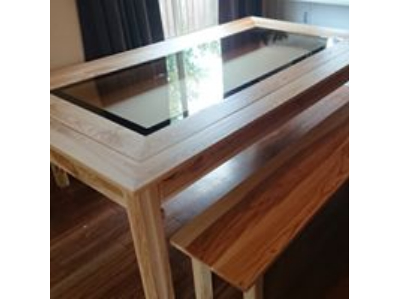 Dining Table with a Games  Table underneath so the games don't have to be put away at mealtimes.
