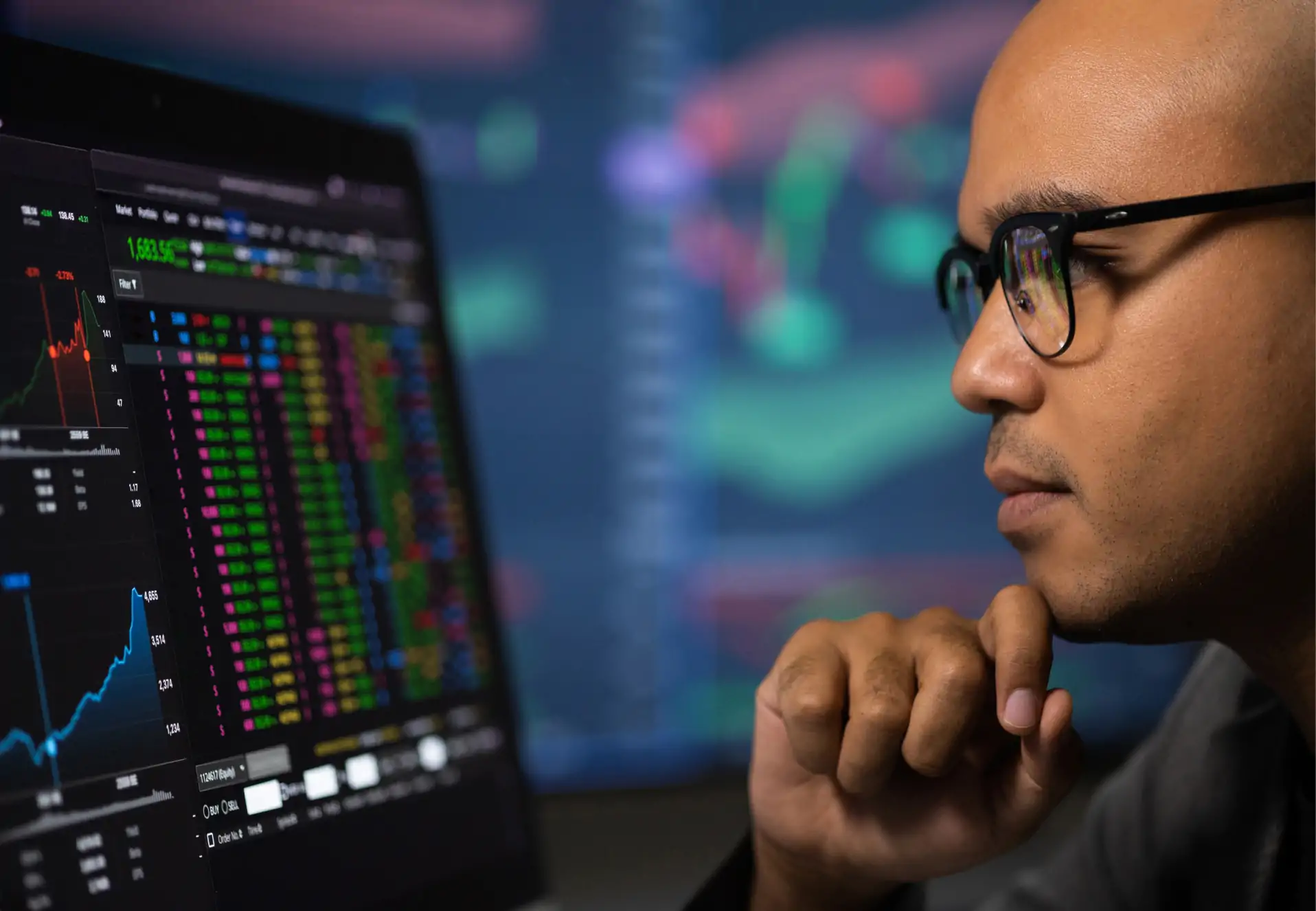 Man looking at real-time data on a screen