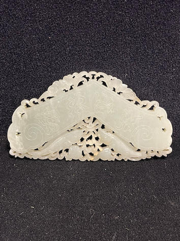 White jade fish-chime pendant — estimate: £600 – £900