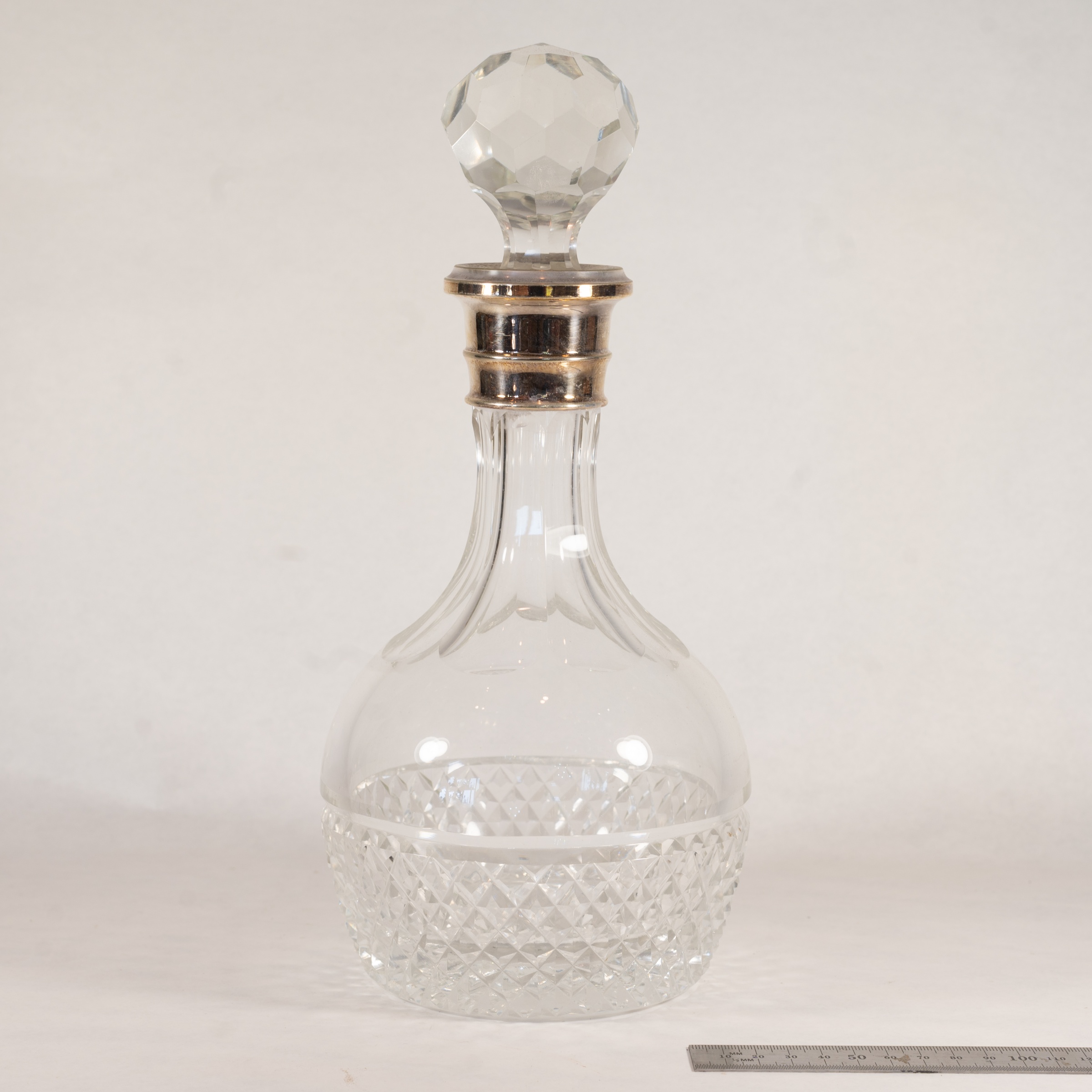 Silver-collared lead-crystal ship's decanter, hallmarked Birmingham 1982 — estimate: $75 – $150