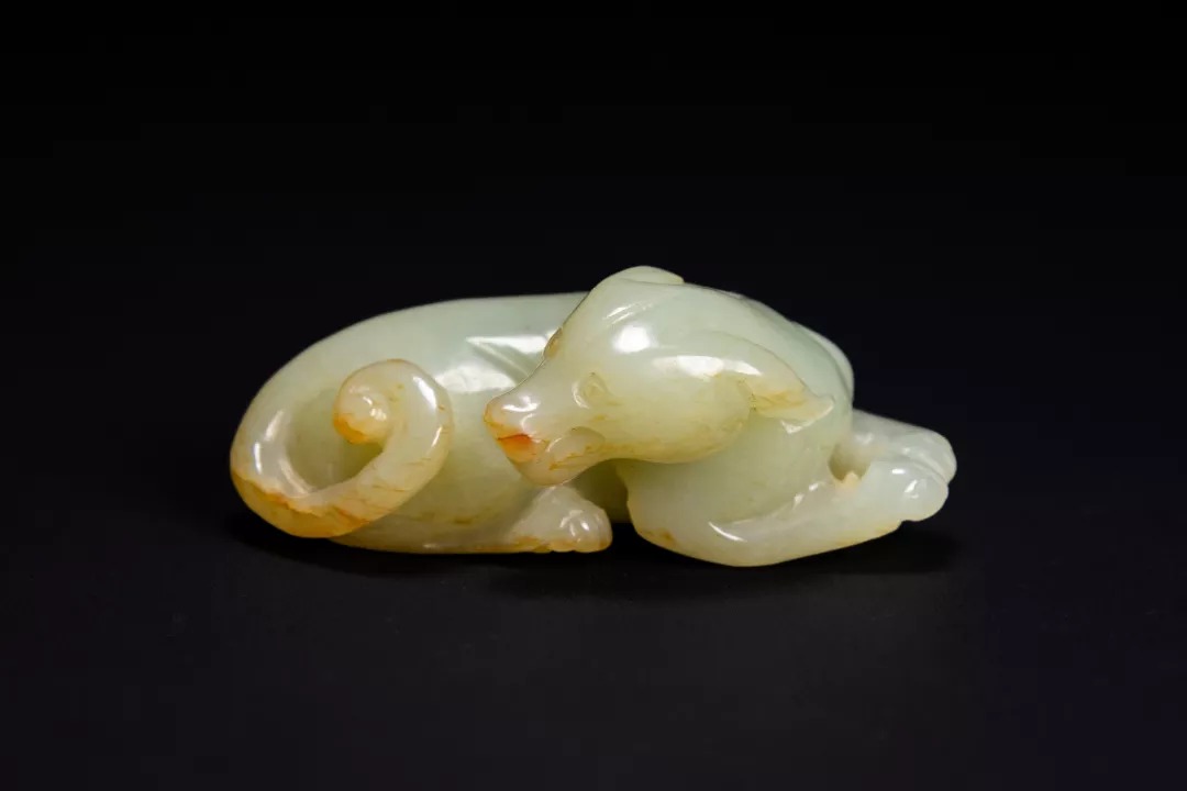 Pale celadon and russet jade recumbent beast — estimate: £3,000 – £5,000