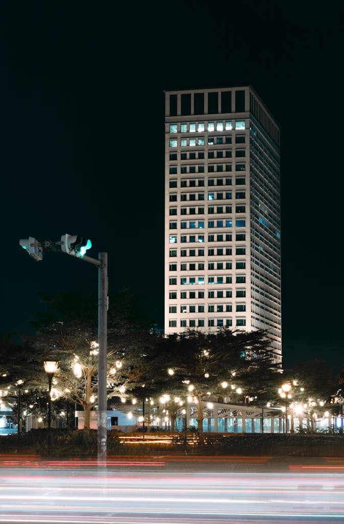 Captivating nighttime view of a lit skyscraper in Phnom Penh, Cambodia.
