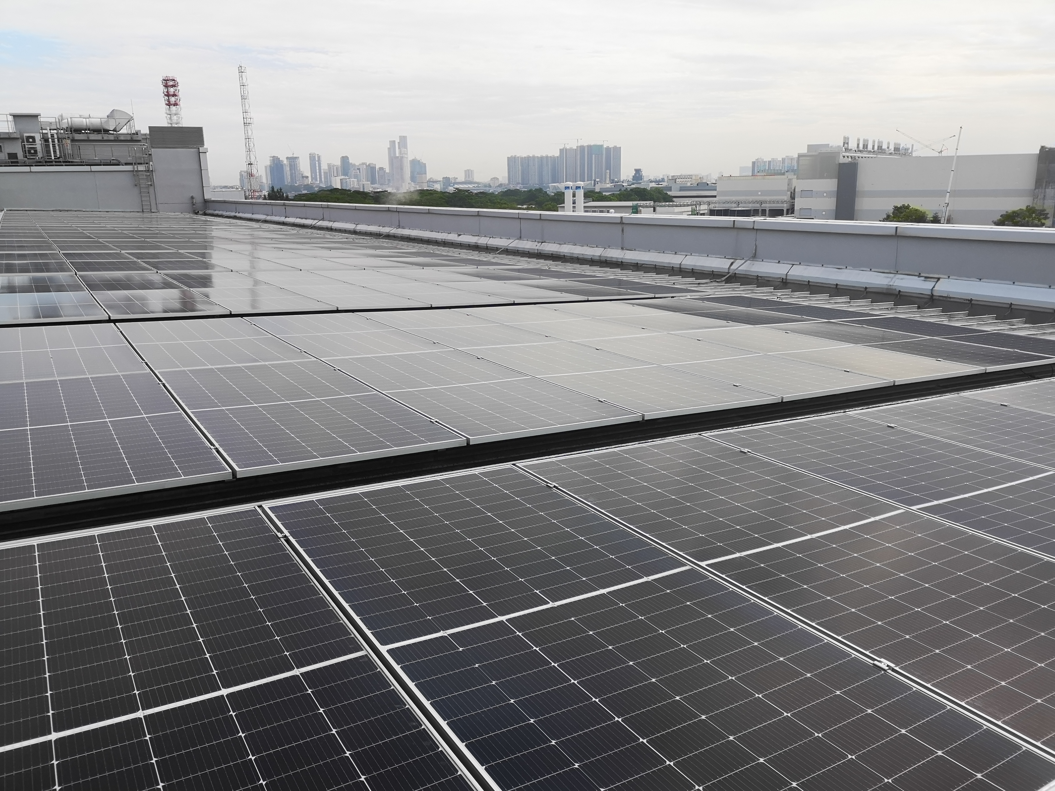 Solar panel installation on commercial building Singapore reducing electricity cost
