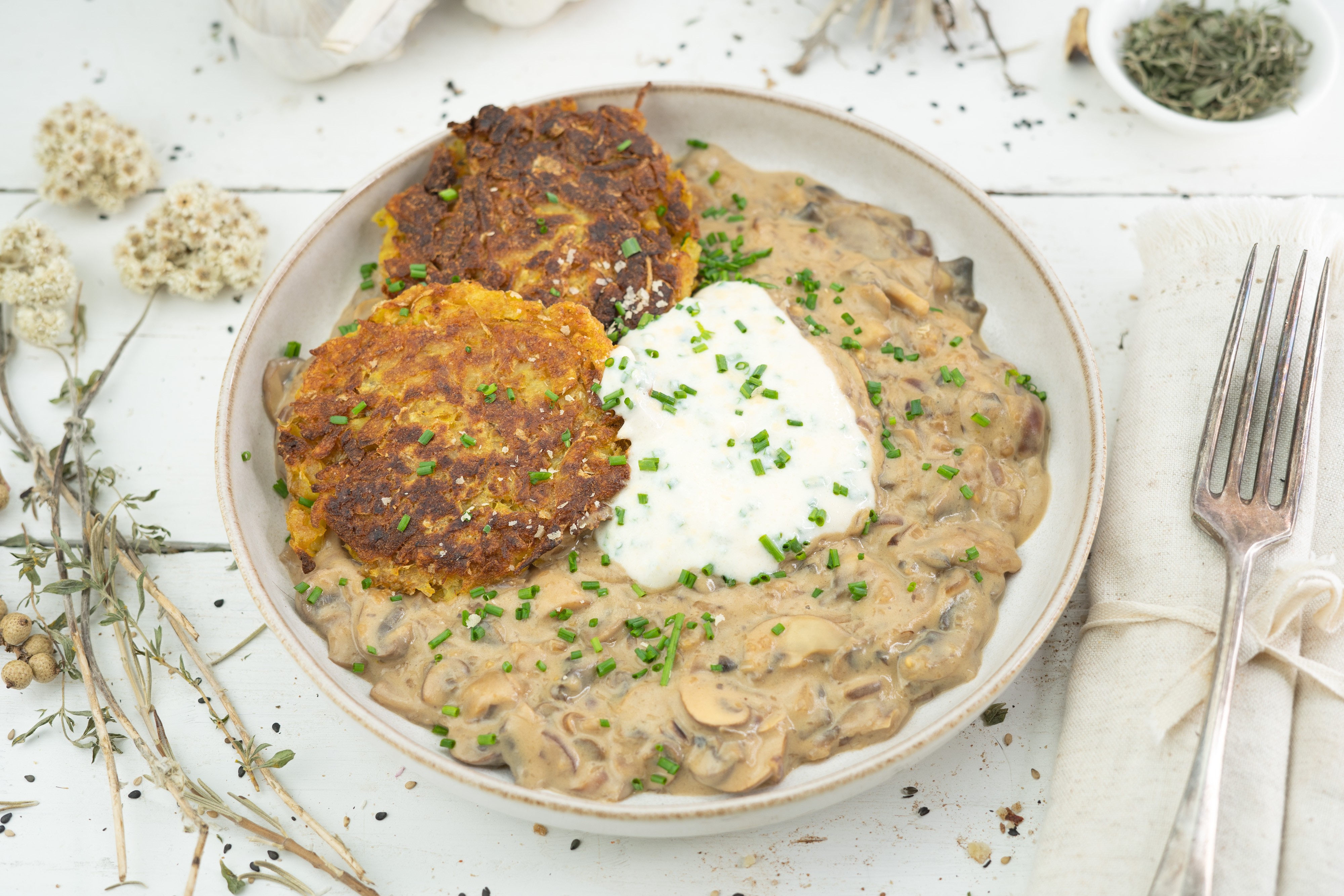 Rezept Serviervorschlag Kartoffelpuffer mit Champignonsauce 
