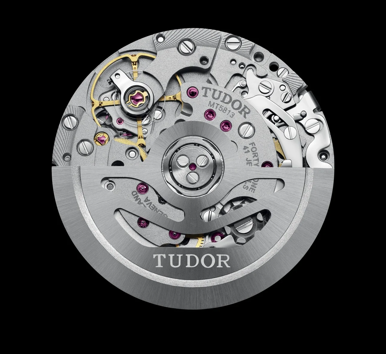 Tudor MT5813 automatic watch movement with exposed gears, 41 ruby jewels, brushed rotor, and 'TUDOR' text.