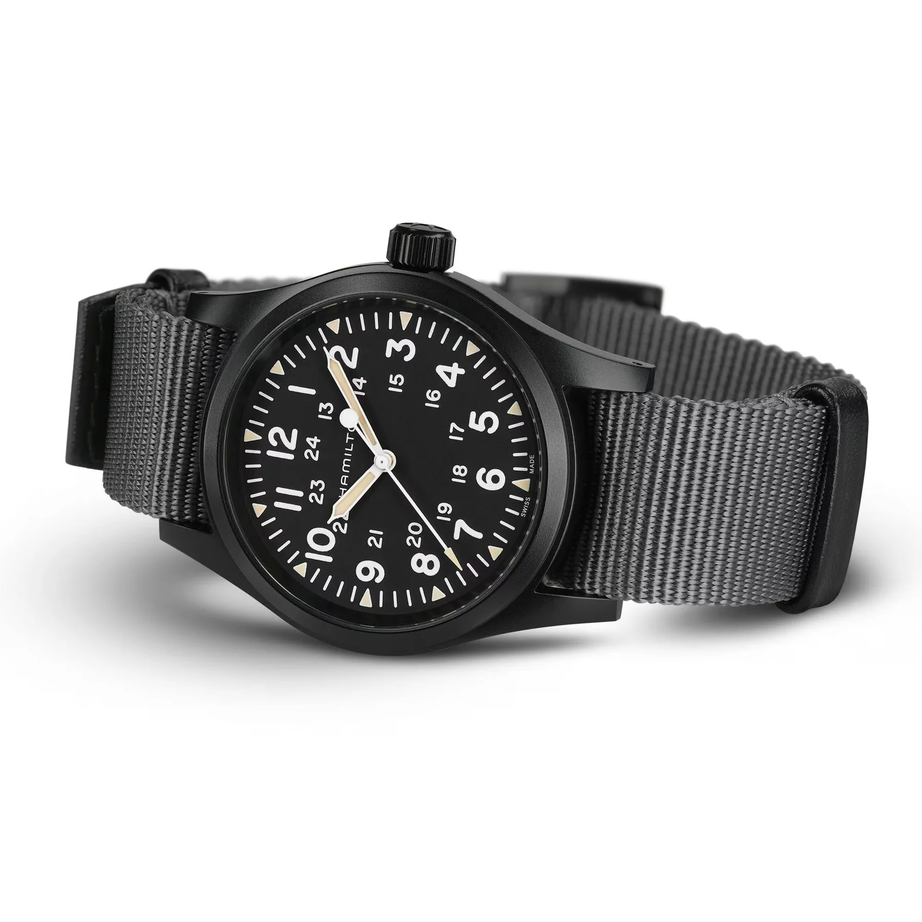 Hamilton Khaki Field Mechanical watch, black PVD case, black dial, white numerals, beige lume, grey NATO strap, white background.
