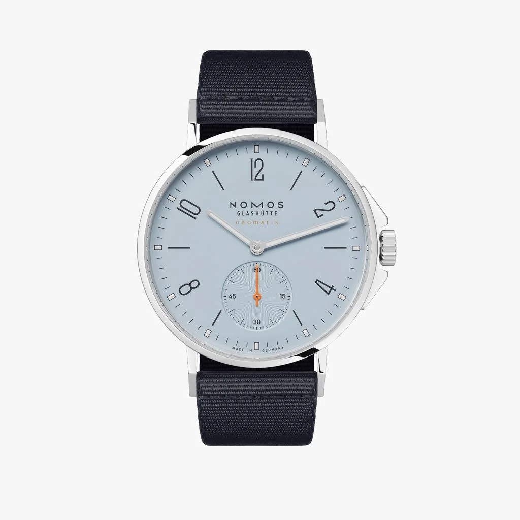 Nomos Glashütte Ahoi Neomatik 36 Sky watch with light blue dial, silver case, and dark blue fabric strap.