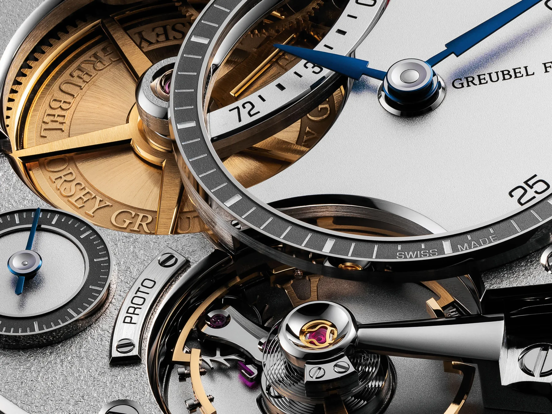 Macro of a Greubel Forsey watch movement: gold & silver components, blue hands, rubies, power reserve, proto, swiss made.