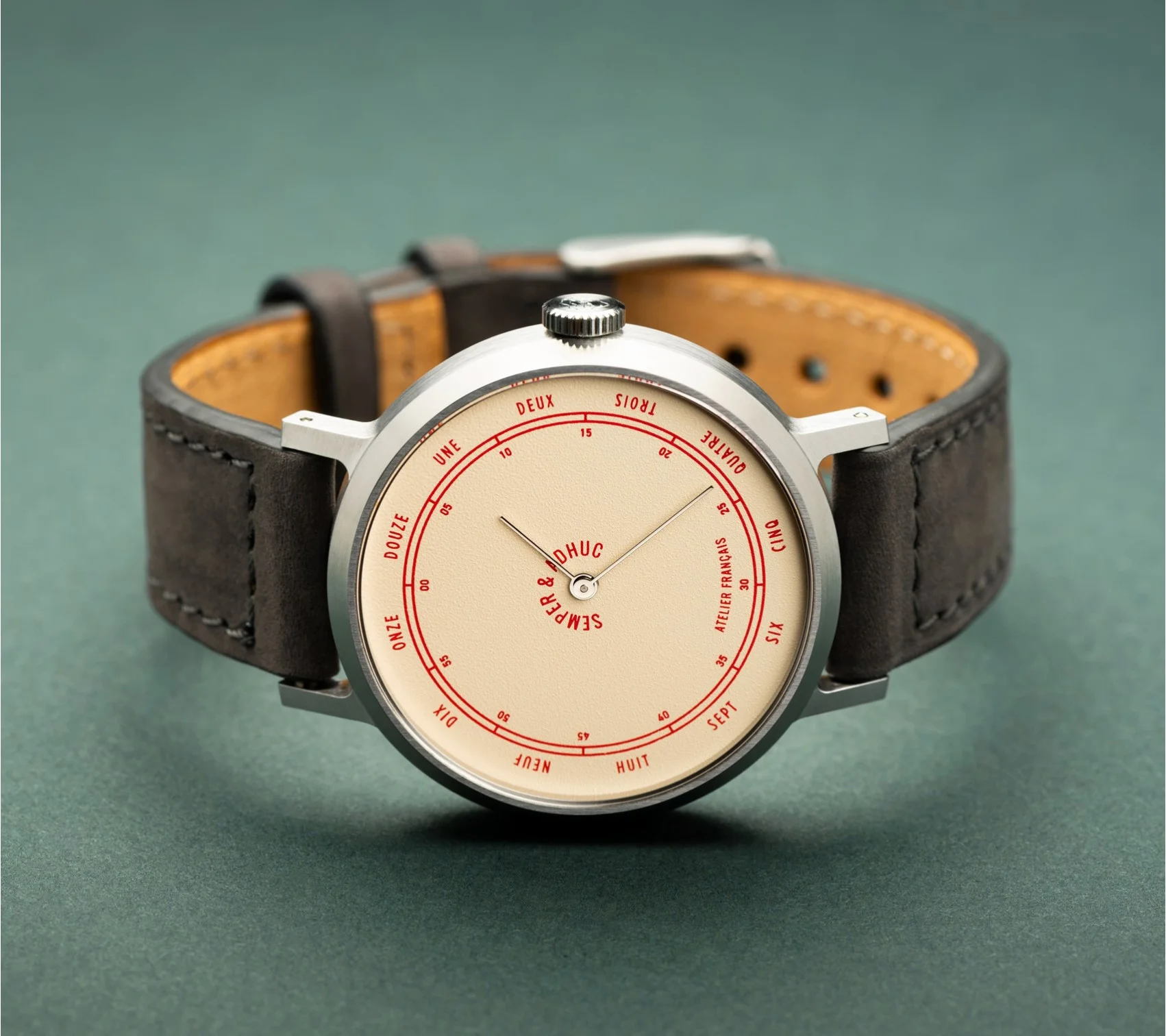 Cream dial watch with silver case, red French numerals & minute track,