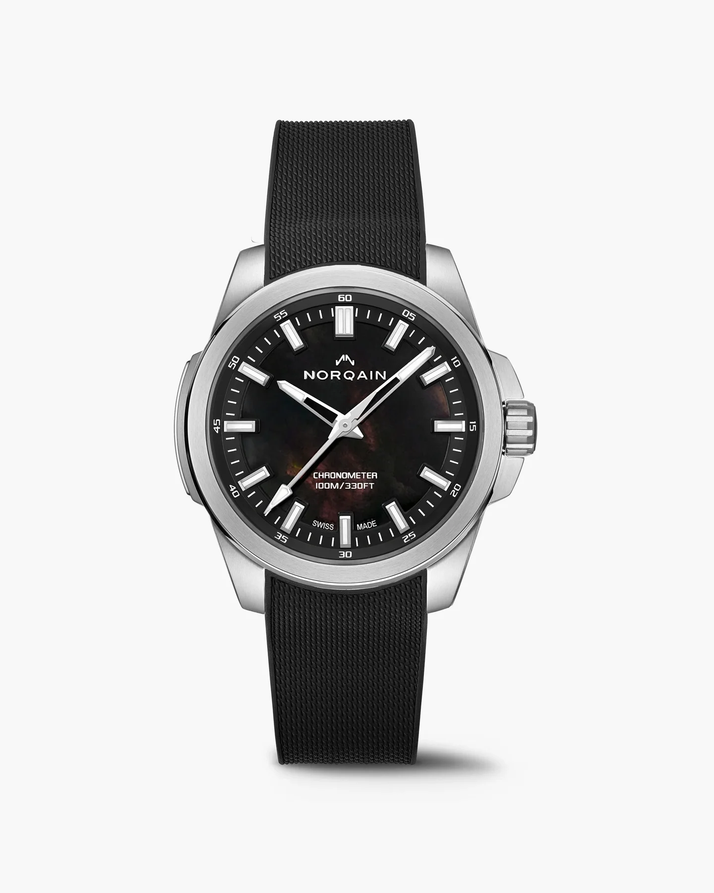 Norqain watch: steel case, dark iridescent dial, white markers/hands, black textured strap, white background.