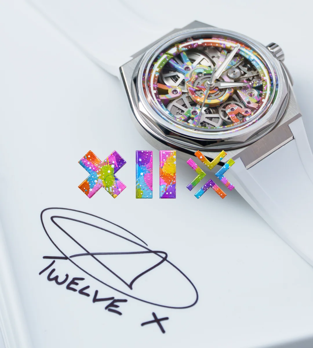 Luxury skeleton watch with a colorful, paint-splattered dial and white strap, next to matching