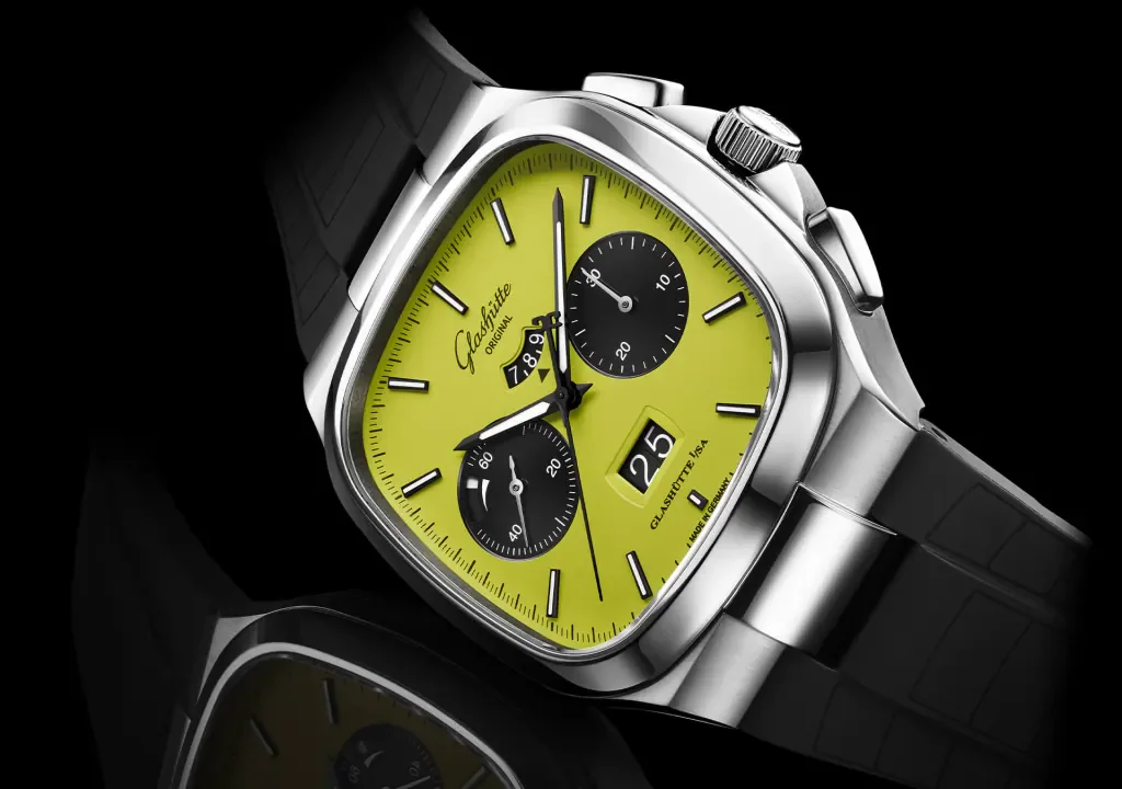 Glashütte Original chronograph with polished steel cushion case, vibrant lime green dial, date, and black strap.