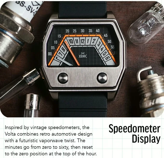Xeric watch with speedometer dial, steel case, black strap, surrounded by spark plugs, fuses, bulb on wood.