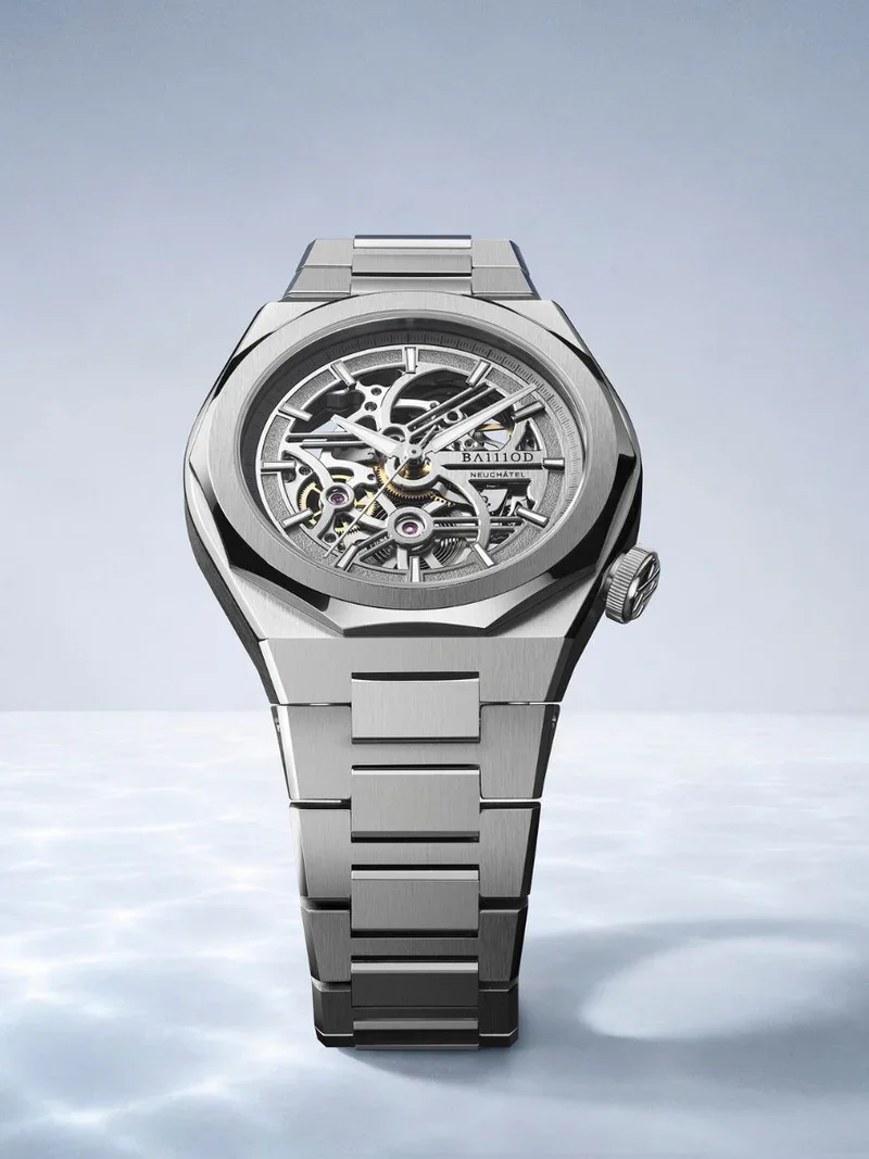 BA111OD skeleton watch, silver-toned, angular case & integrated bracelet. Intricate mechanical movement visible on reflective surface.