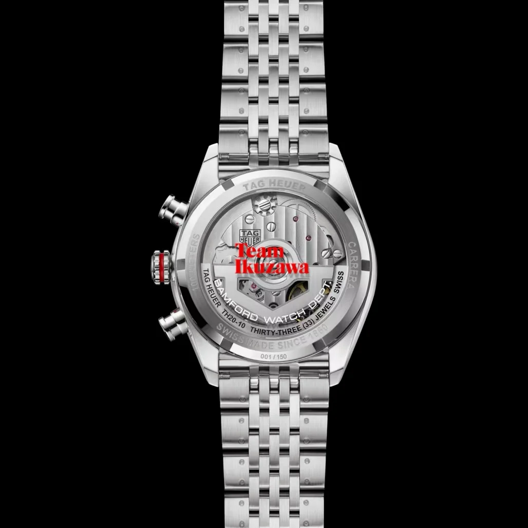 Back of a Tag Heuer Carrera x Bamford watch, showing automatic movement through the open case back & metal bracelet. Black background.