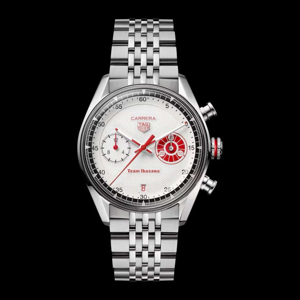 TAG Heuer Carrera chronograph with white textured dial, red accents, steel jubilee bracelet, on black background.